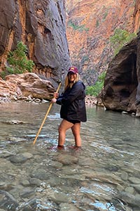 Katie Niznik standing in a stream