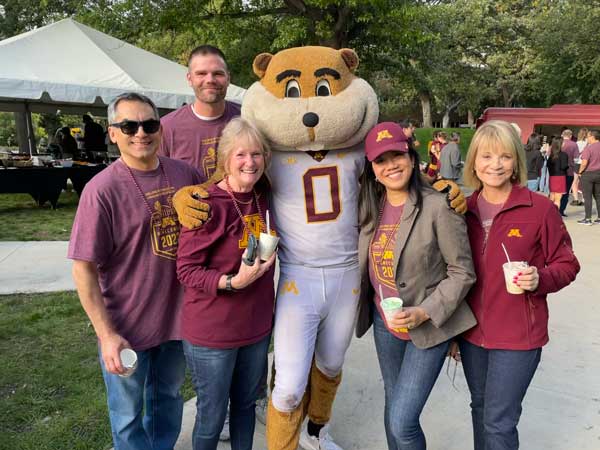 Five individuals get together with Goldy
