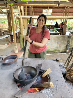 Neela Nandyal cooking over an open fire
