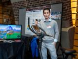 Attendee smiling with prototype 