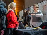 Two attendees having a conversation at research day 2024 