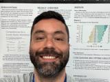 Jonathan Andicoechea presents a research poster.