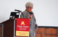 Lin Dunn speaks from the podium at the 2016 Womens Coaching Symposium